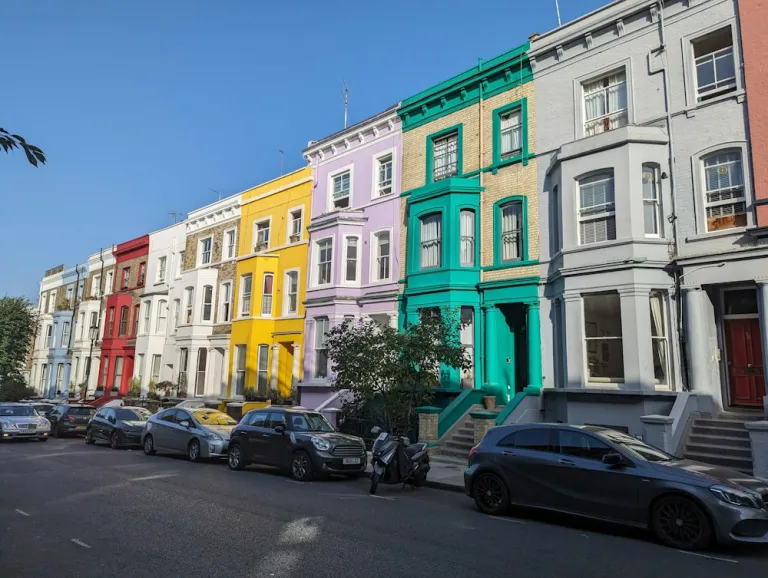 Row of colourful terraced houses on a west London street