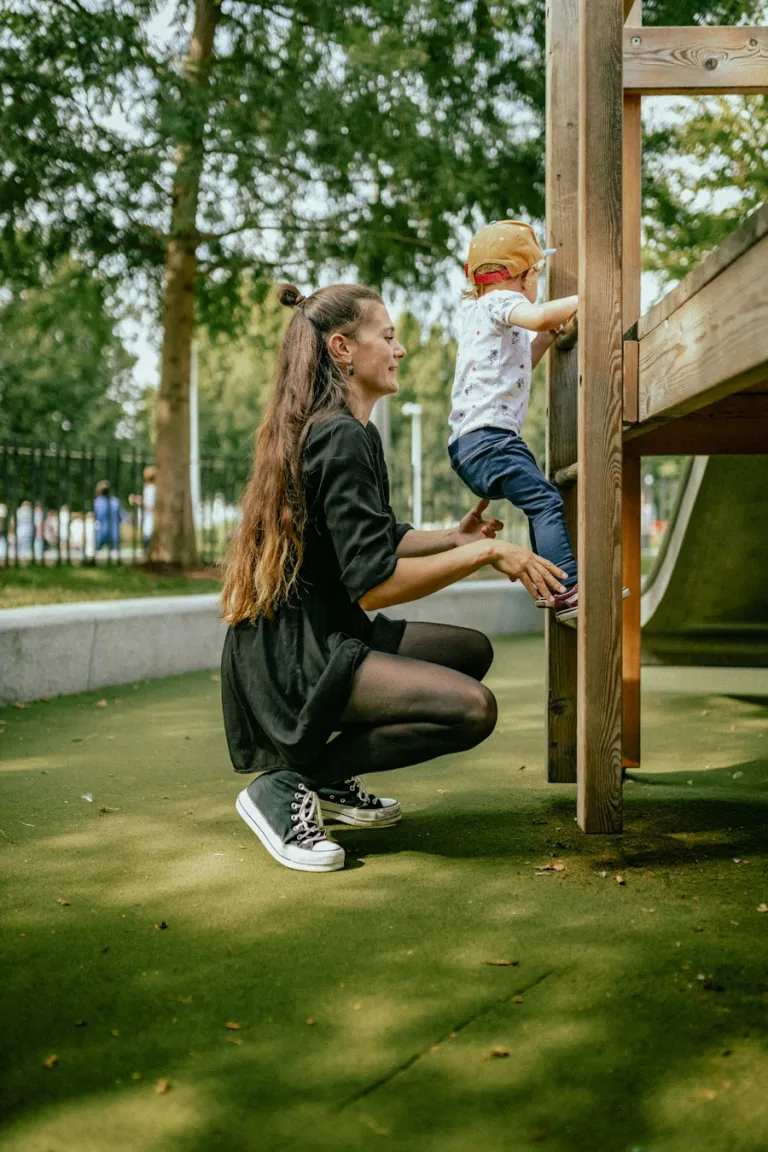 Parent and child playing in a London playground
