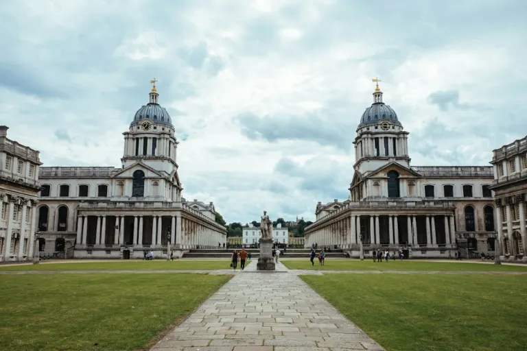 People walking by the Old Royal Naval College in Greenwich